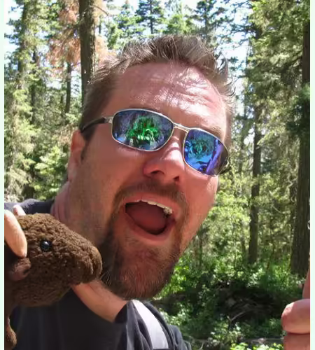 Matt Sharpe hiking with a stuffed buffalo